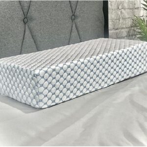 A white and gray bed with a mattress on top of it
